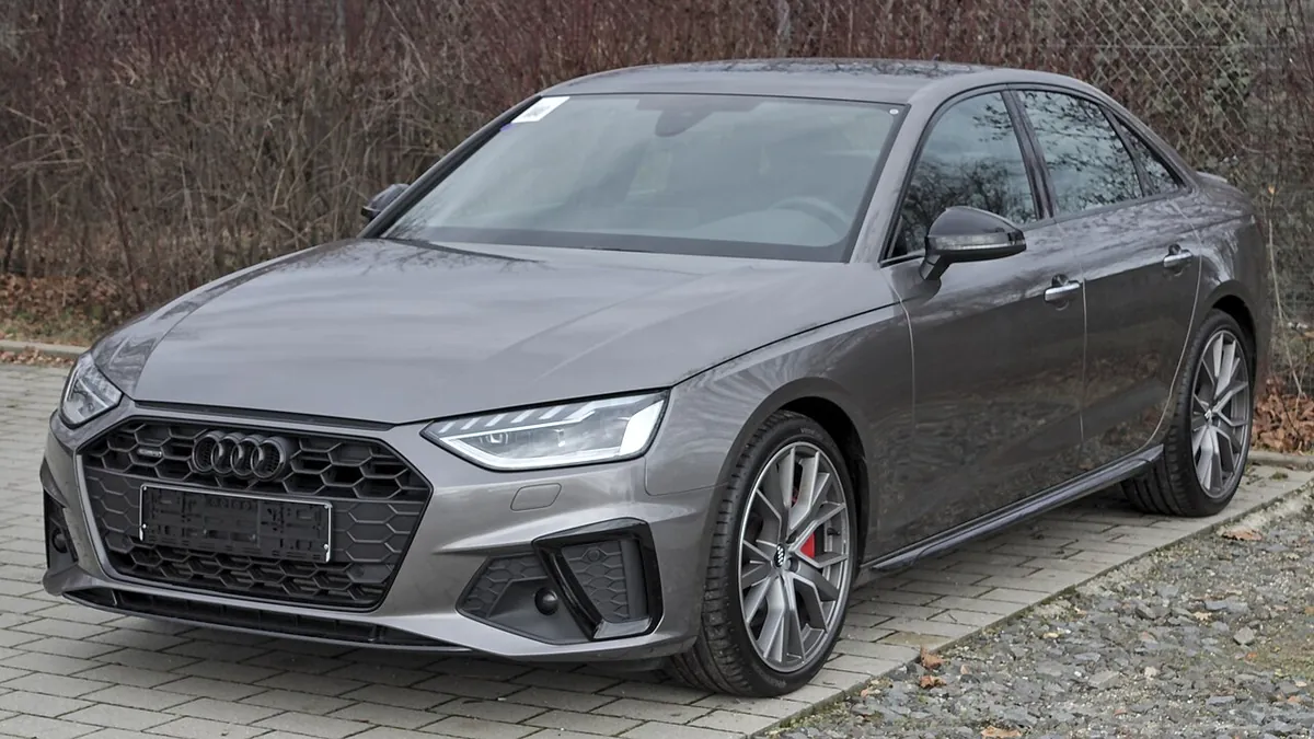 Grey Audi A4 B9 facelift sedan viewed from the front and side