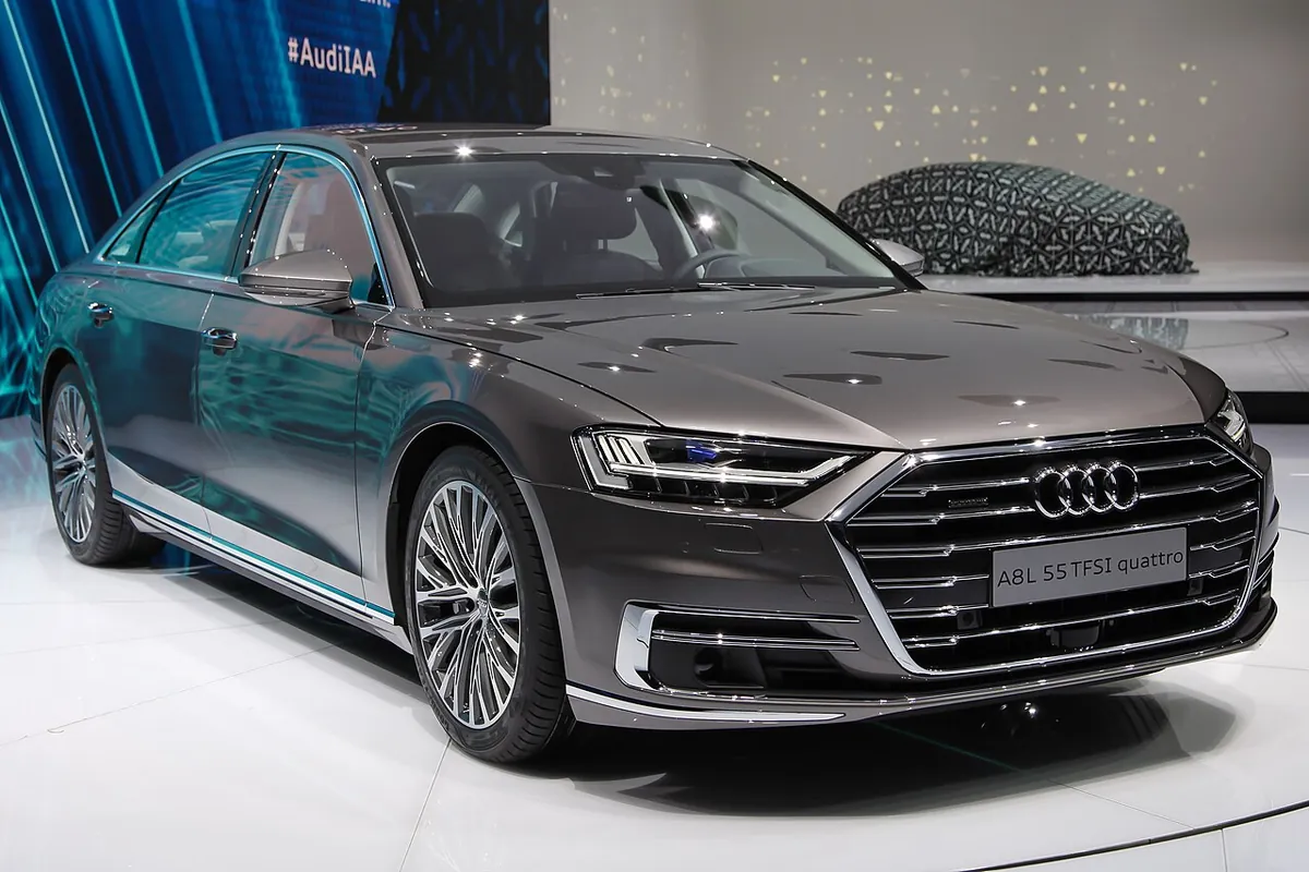 Grey long-wheelbase Audi A8 L D5 displayed at a motor show