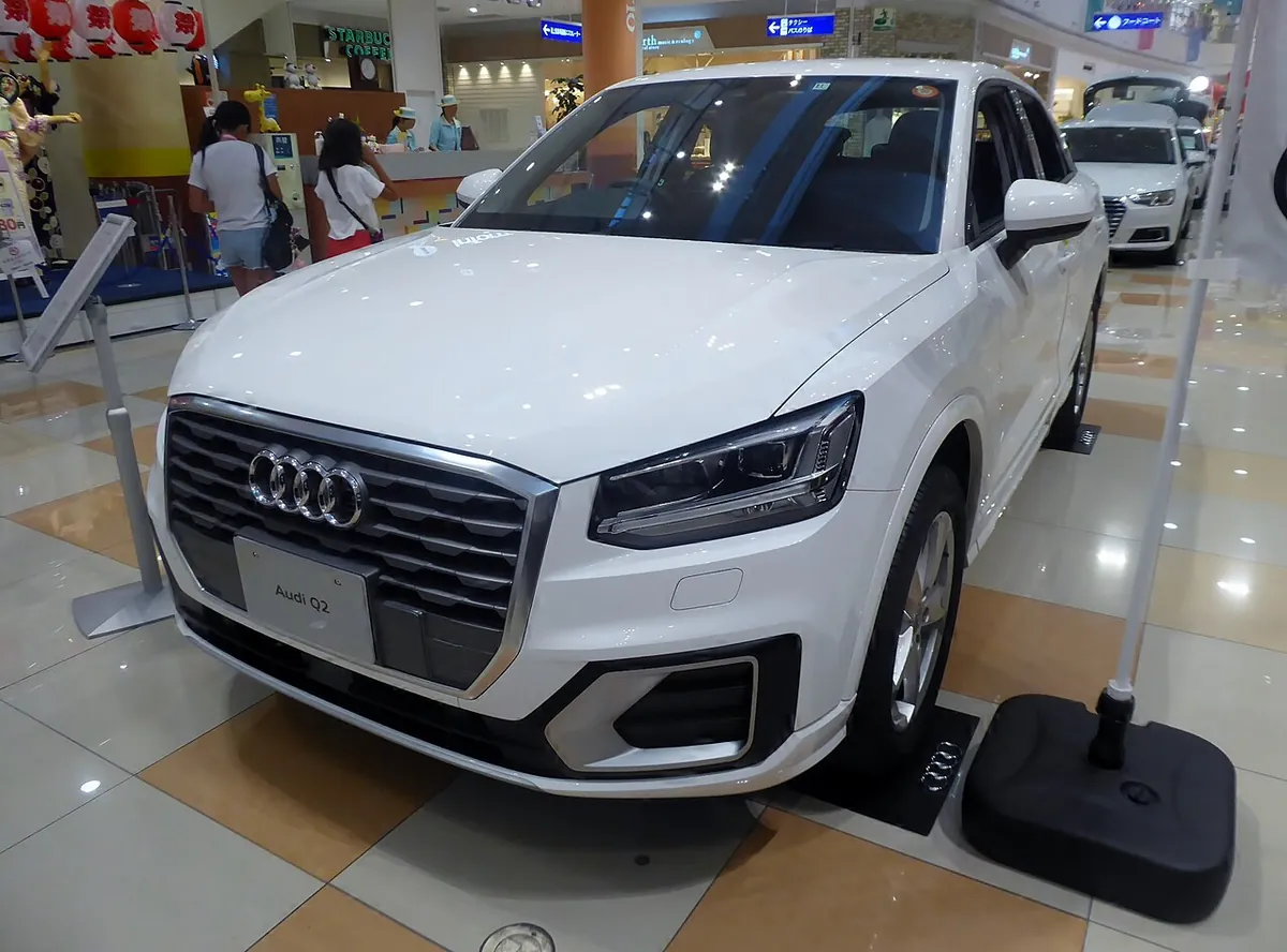 White Audi Q2 viewed from the front and side