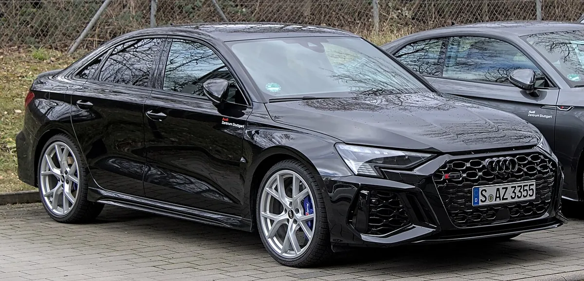Audi RS 3 8Y performance sedan viewed from the front and side