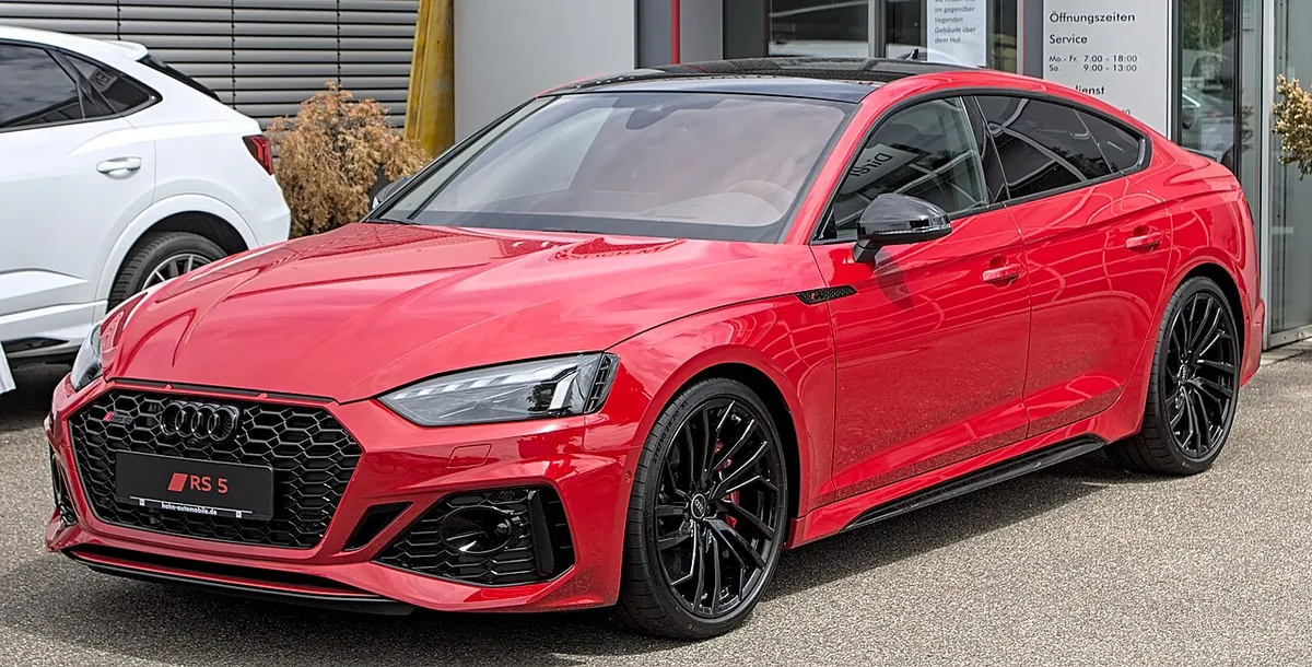 Red Audi RS 5 F5 facelift Sportback viewed from the front and side