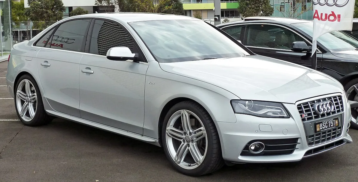 Silver Audi S4 B8 sedan viewed from the front and side