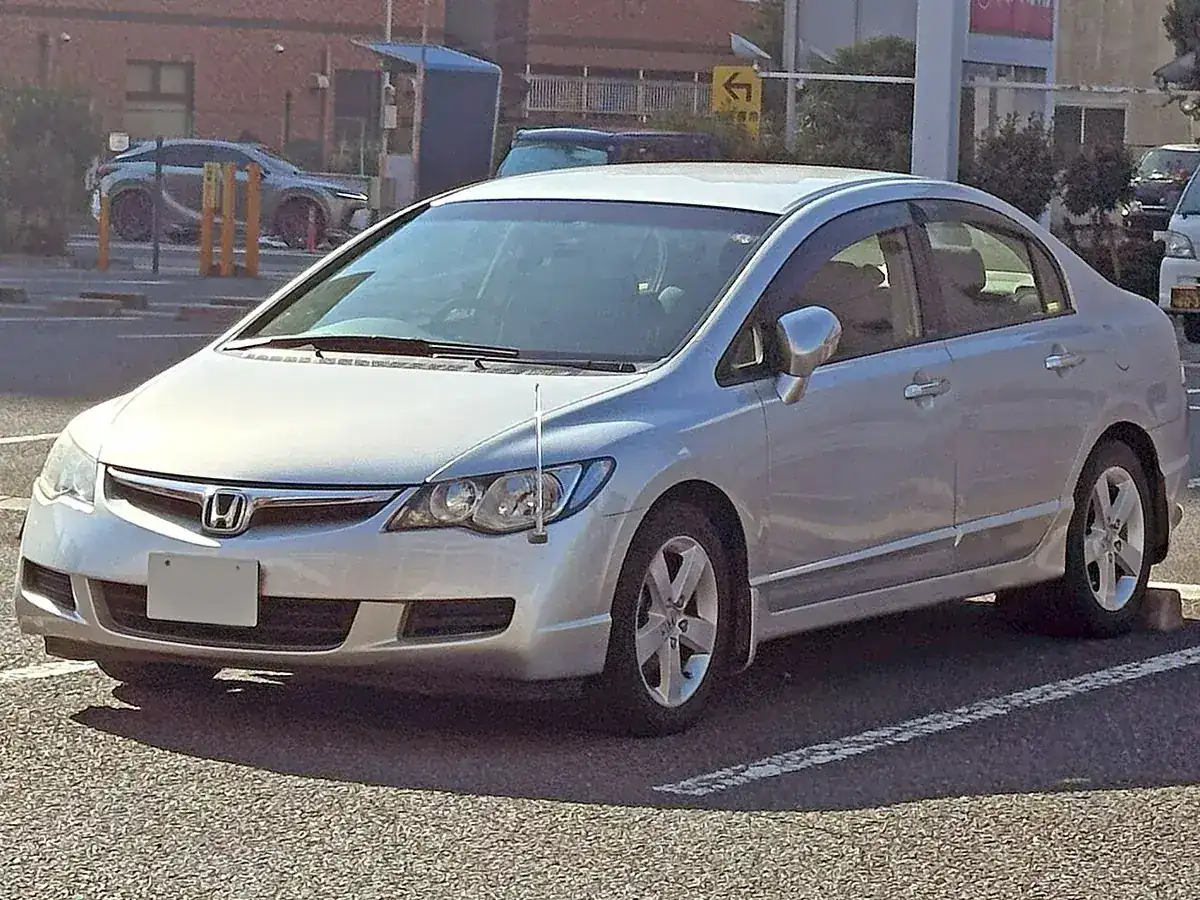 Silver eighth-generation Honda Civic 1.8GL sedan viewed from the front and side