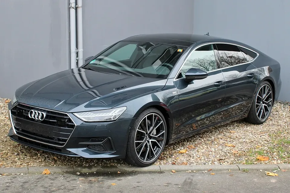 Grey Audi A7 C8 Sportback viewed from the front and side