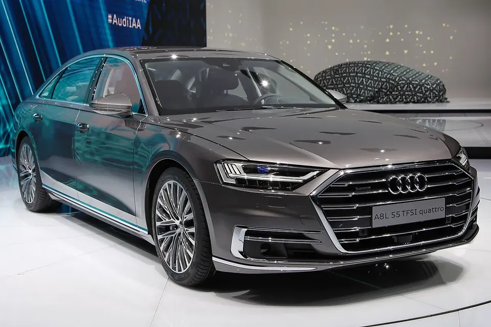 Grey long-wheelbase Audi A8 L D5 displayed at a motor show