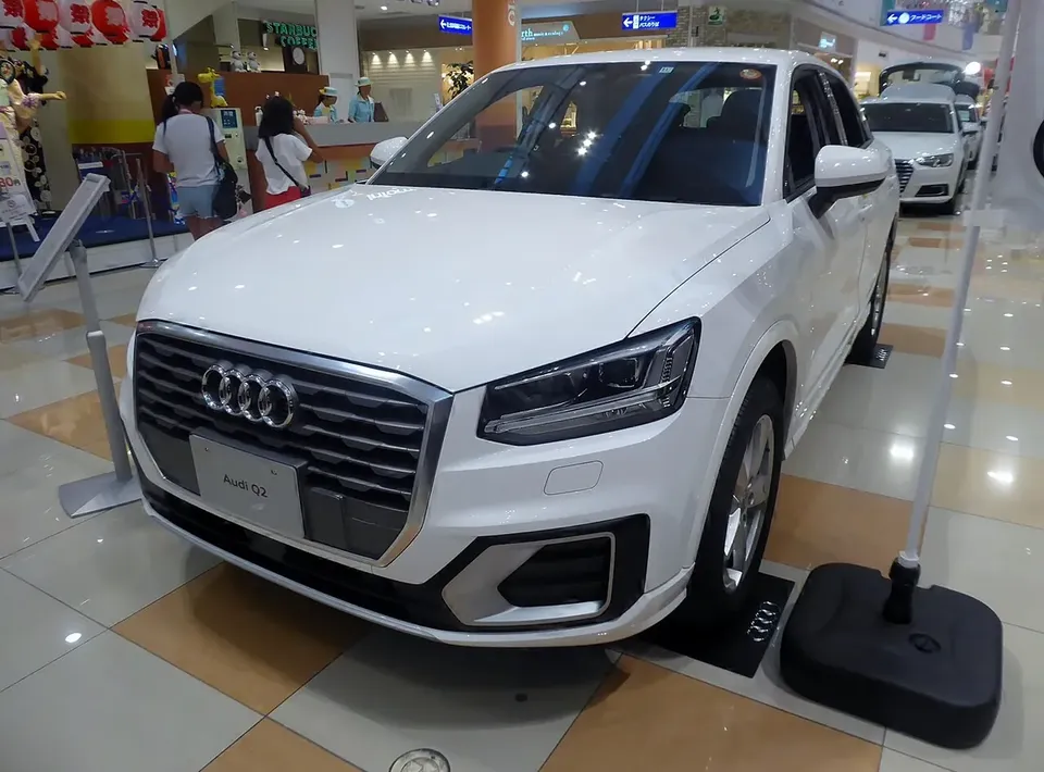 White Audi Q2 viewed from the front and side