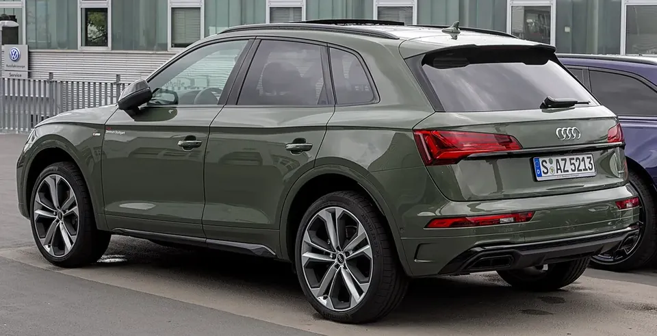 Green Audi Q5 FY facelift SUV viewed from the rear and side