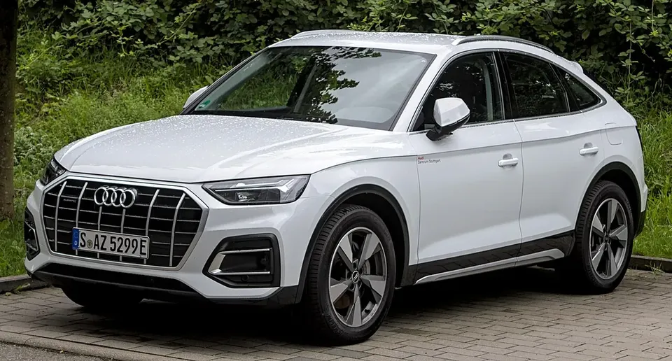 White Audi Q5 FY Sportback viewed from the front and side