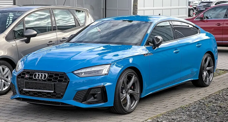 Blue Audi S5 F5 facelift Sportback viewed from the front and side