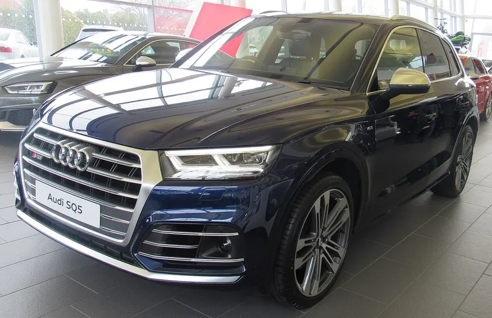 Blue Audi SQ5 FY performance SUV viewed from the front and side