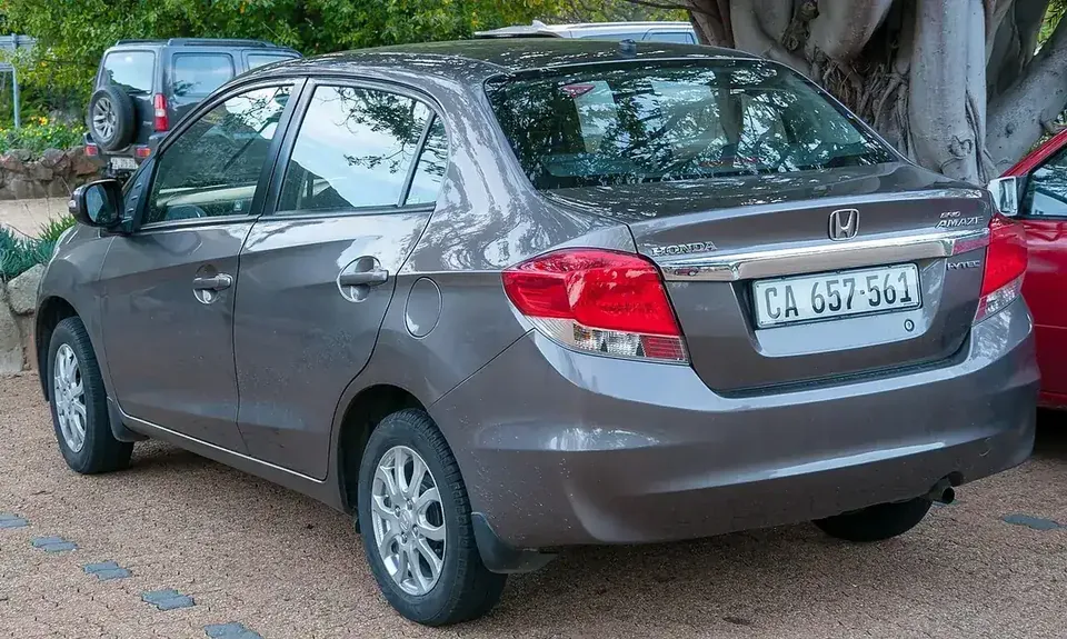 Grey first-generation Honda Brio Amaze viewed from the rear and side in Cape Town