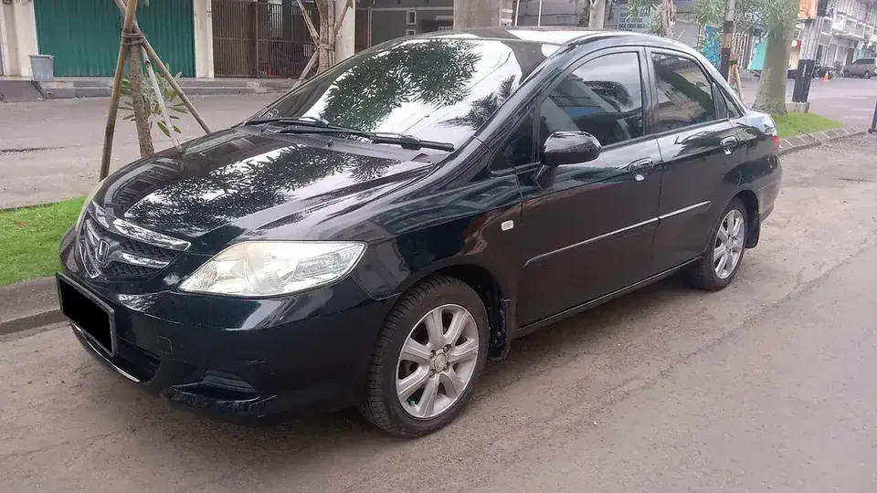 Black facelift second-generation Honda City viewed from the front and side in Indonesia