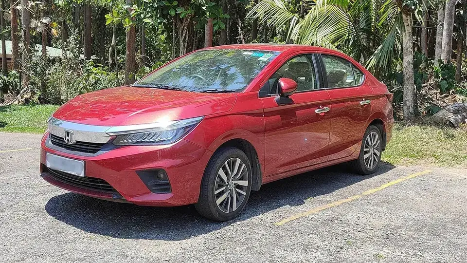 Red 2022 Honda City ZX i-VTEC viewed from the front and side