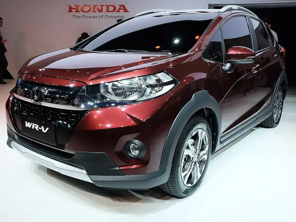 Red 2017 first-generation Honda WR-V viewed from the front and side at a display