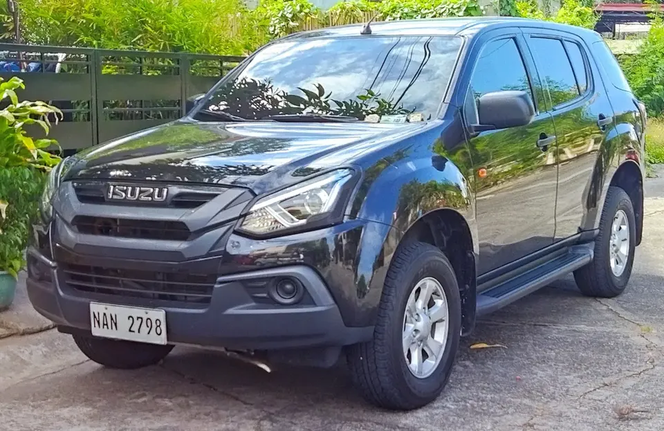 Black first-generation facelift Isuzu mu-X LS SUV photographed in the Philippines