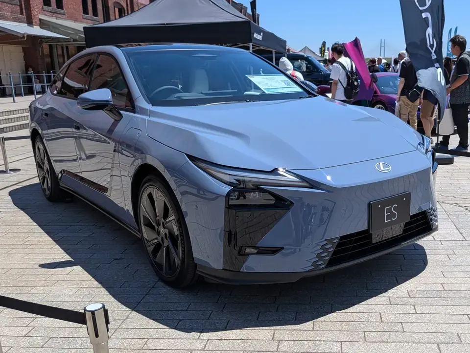 Eighth-generation Lexus ES 500e battery-electric sedan in a front three-quarter view.