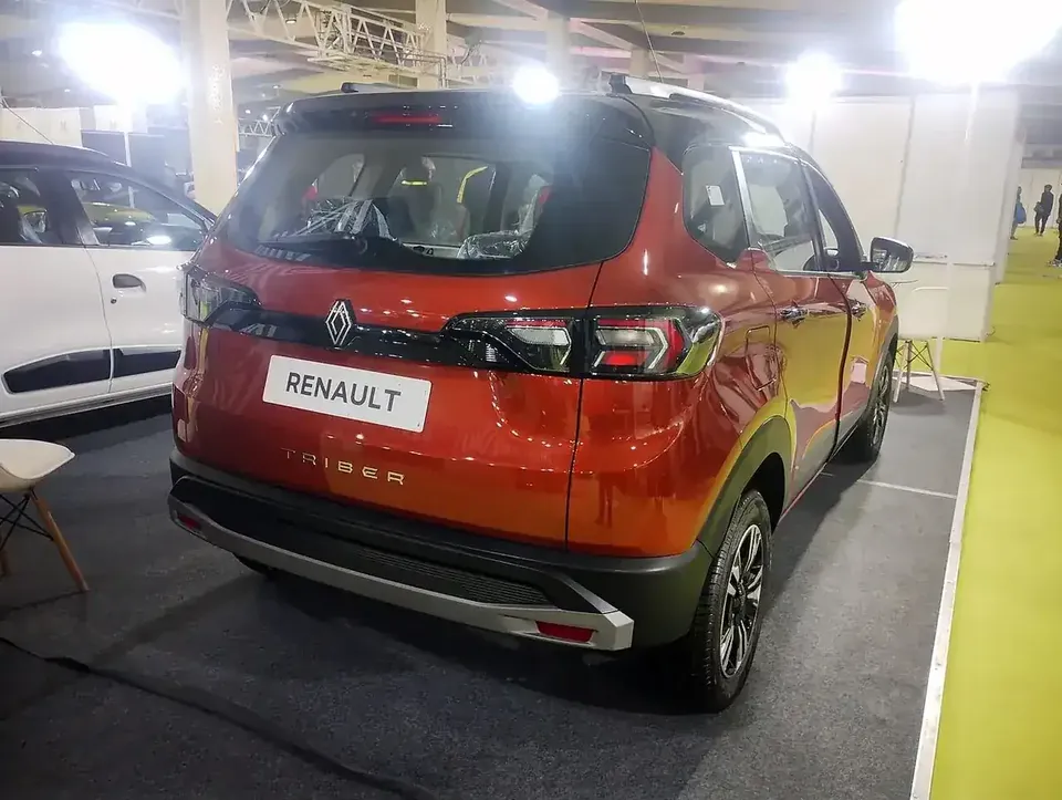 Red Renault Triber viewed from the rear and side at a Bangalore auto show