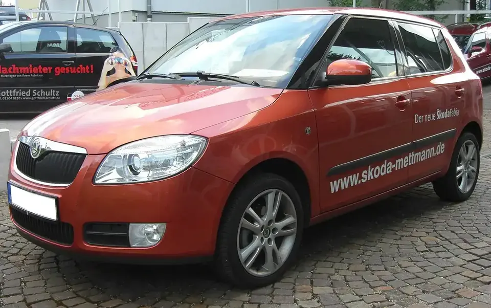 Red second-generation Škoda Fabia hatchback seen from the front and side