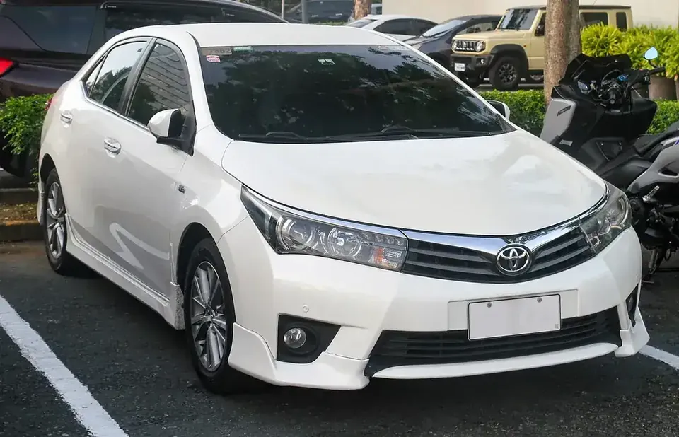 White 2016 Toyota Corolla Altis E170 viewed from the front and side