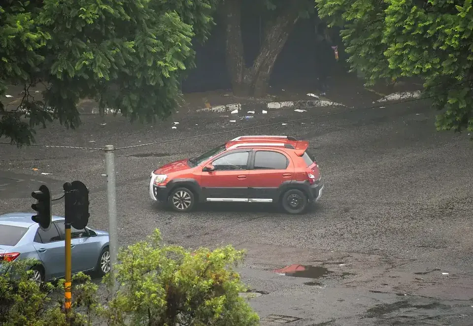 Red Toyota Etios Cross viewed from the side on a road in Johannesburg