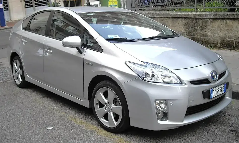 Silver 2010 Toyota Prius XW30 viewed from the front and side