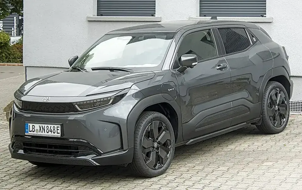 Grey Toyota Urban Cruiser battery-electric SUV viewed from the front and side in Germany