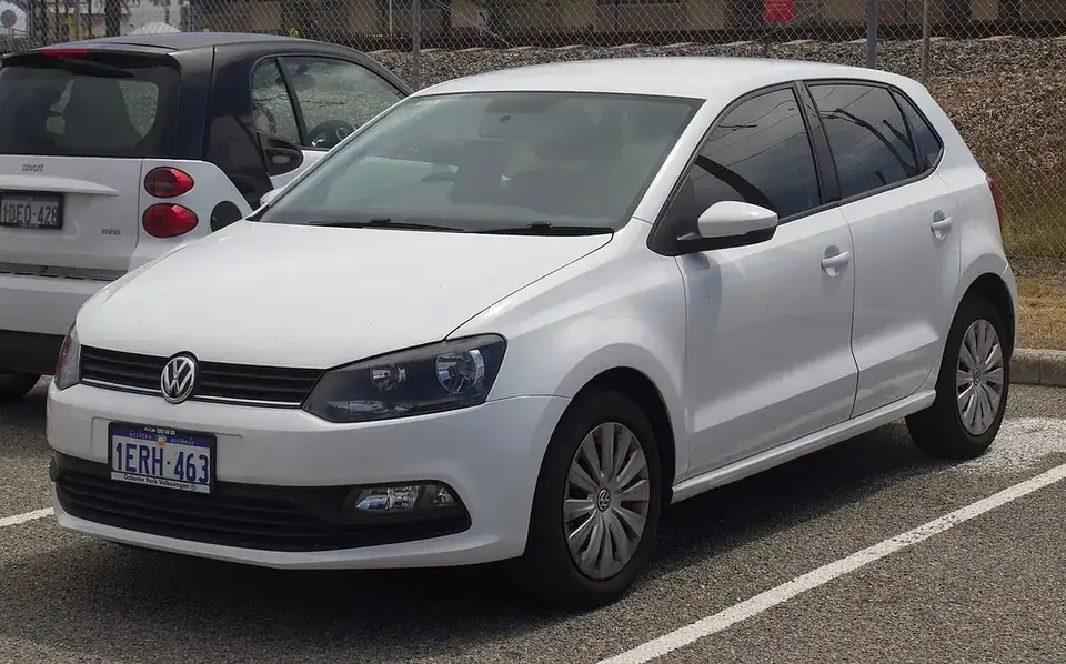 White facelift Volkswagen Polo Mk5 five-door hatchback viewed from the front and side