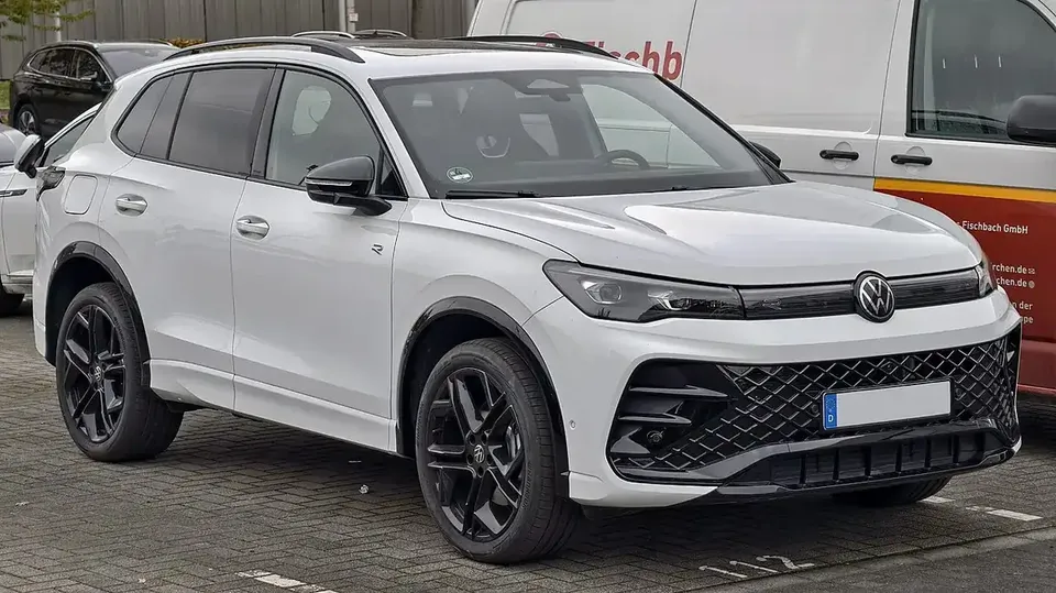 White third-generation Volkswagen Tiguan R-Line viewed from the front and side