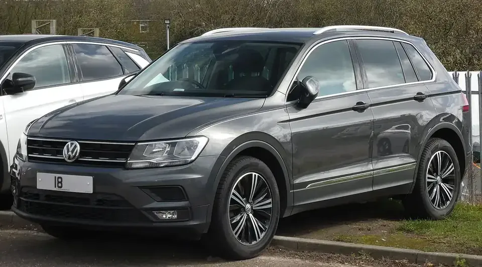 Grey second-generation Volkswagen Tiguan SUV viewed from the front and side