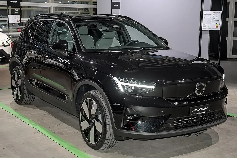 Black Volvo EX40 electric SUV seen from the front and side
