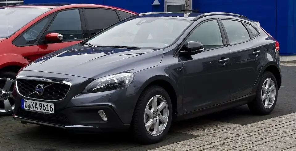 Dark Volvo V40 Cross Country raised hatchback seen from the front and side