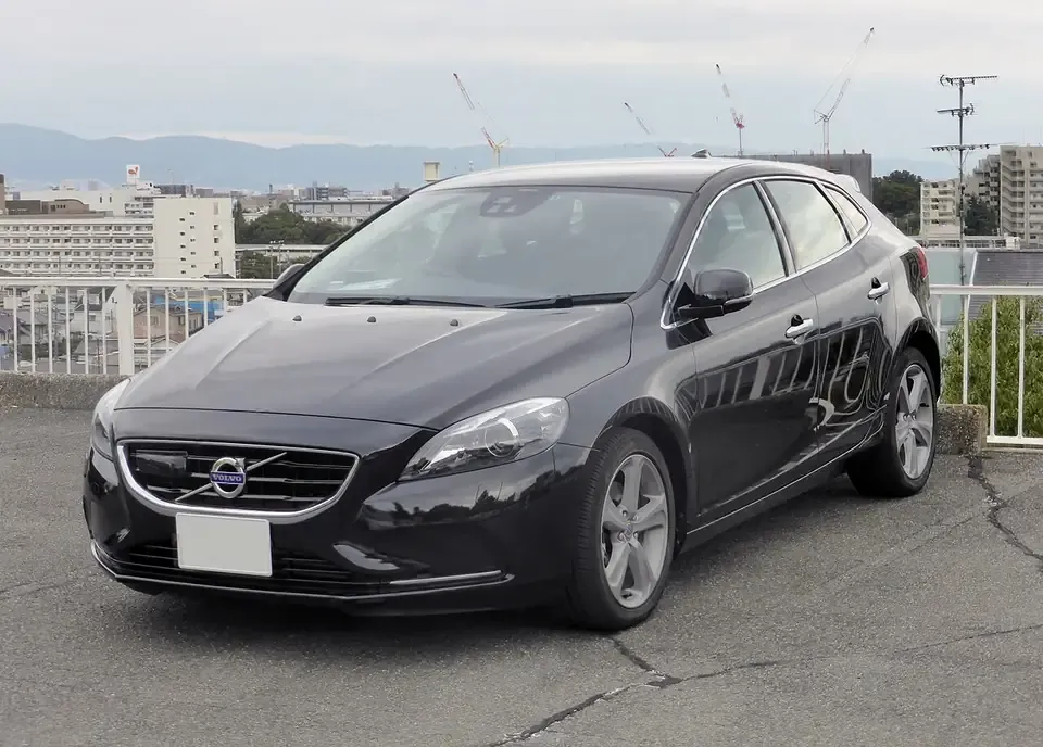 Dark Volvo V40 five-door hatchback seen from the front and side
