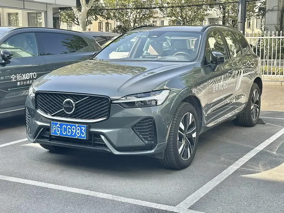 Grey Volvo XC60 second-generation facelift seen from the front and side