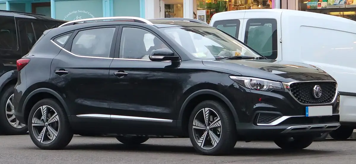 Black original-generation MG ZS EV viewed from the front and side