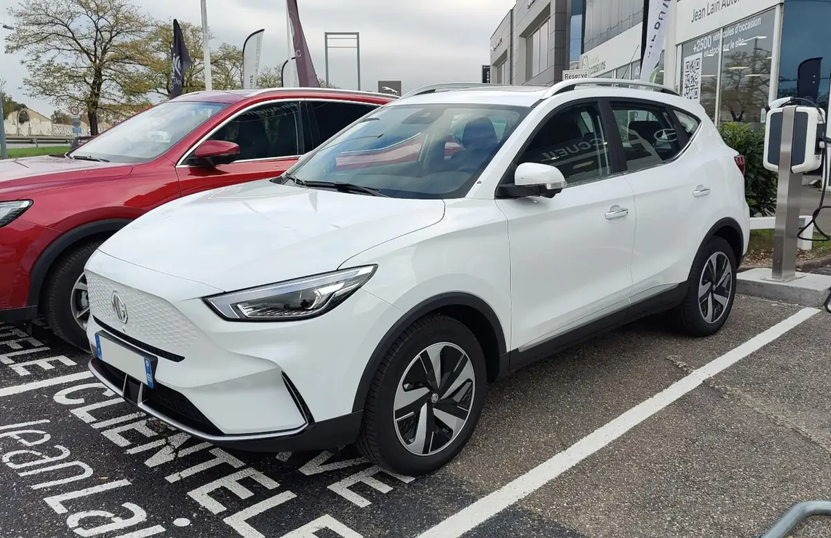 White facelift MG ZS EV electric SUV viewed from the front and side