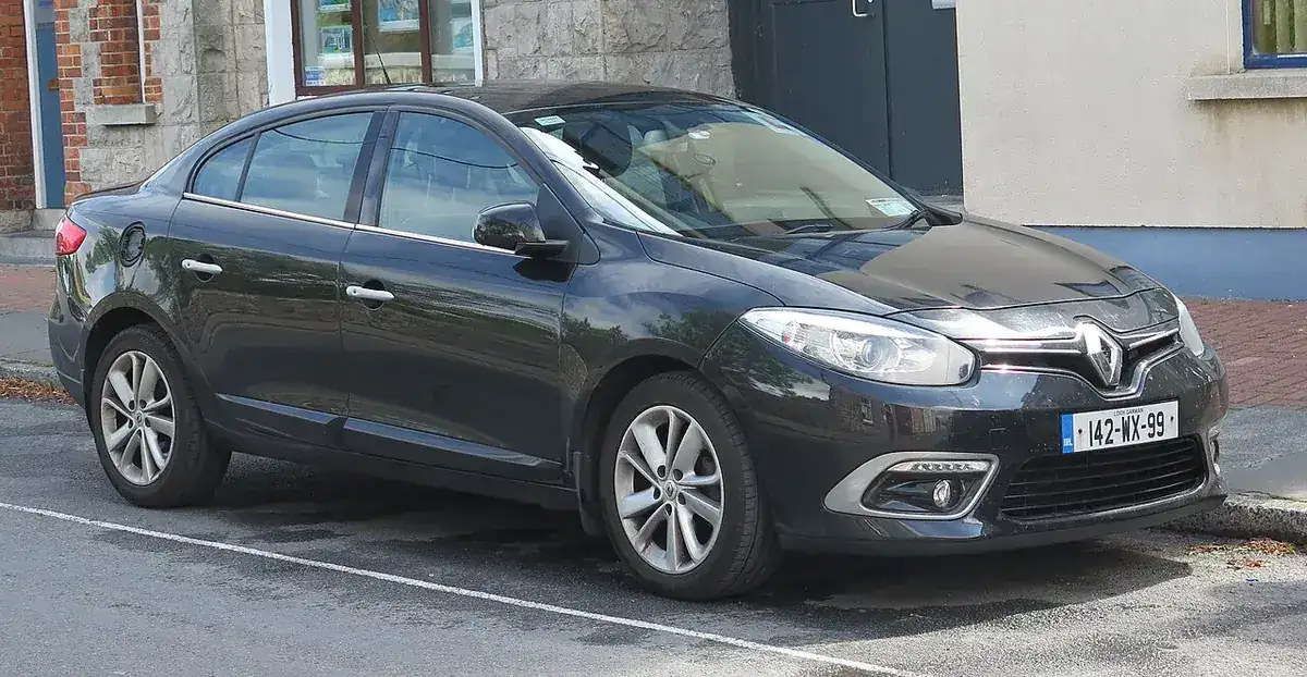 Black facelift Renault Fluence sedan viewed from the front and side in Galway