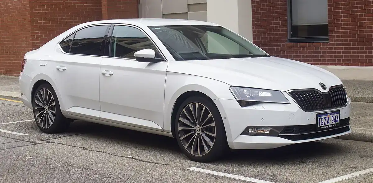 White third-generation Škoda Superb liftback seen from the front and side in Fremantle