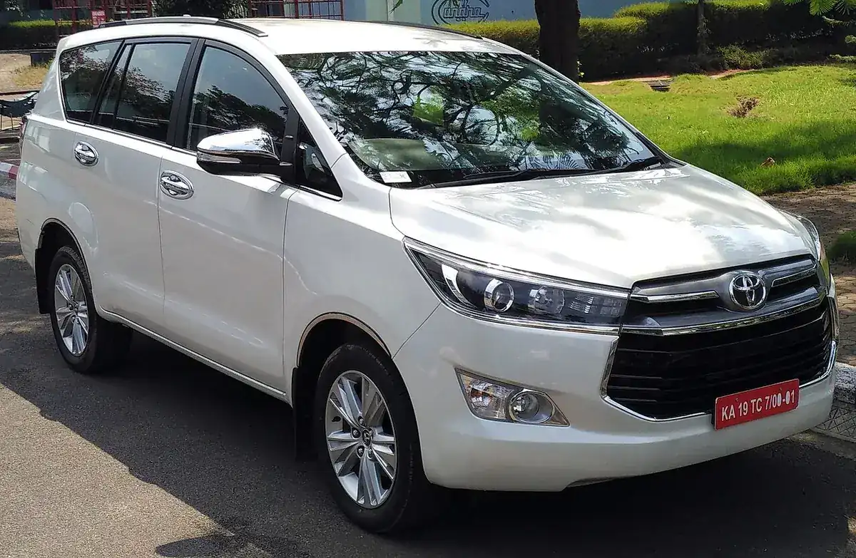 White 2016 Toyota Innova Crysta 2.4 Z viewed from the front and side