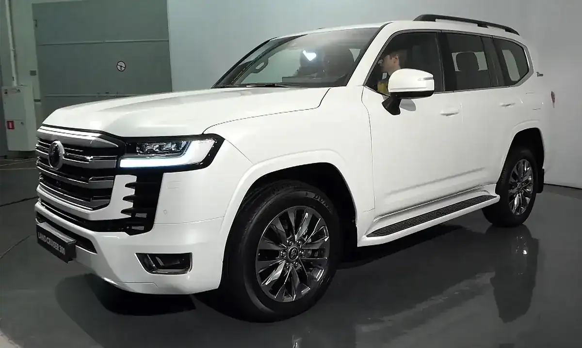 White 2021 Toyota Land Cruiser 300 viewed from the front and side