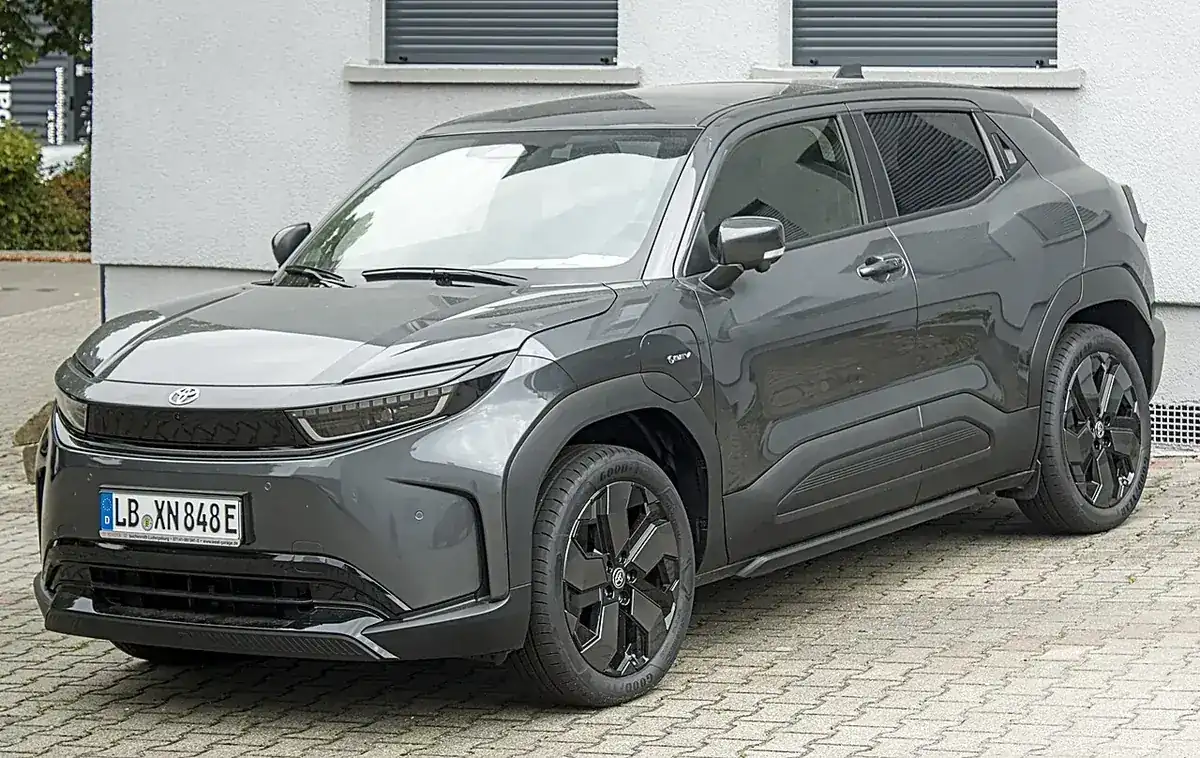 Grey Toyota Urban Cruiser battery-electric SUV viewed from the front and side in Germany