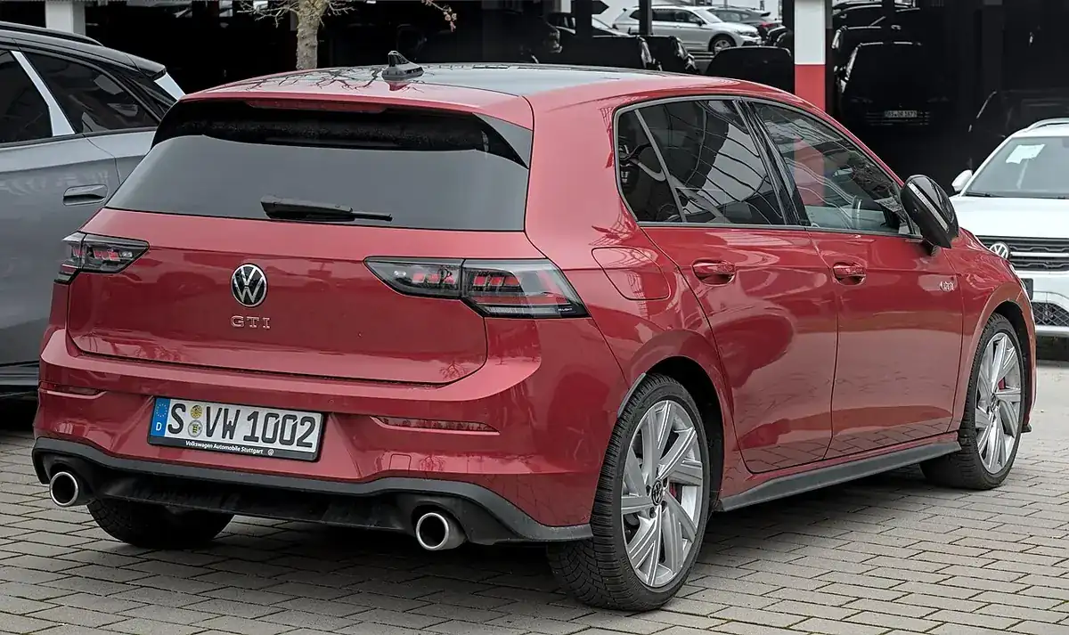 Red Volkswagen Golf GTI Mk8 facelift viewed from the rear and side