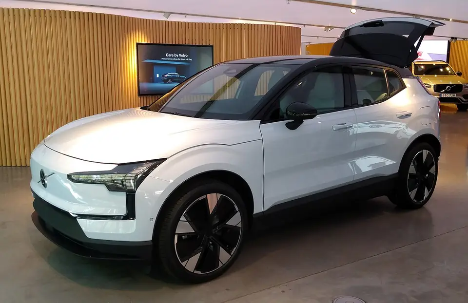 White Volvo EX30 electric SUV seen from the front and side